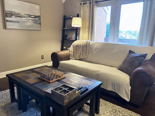 Living room with patio access - 5550 Spring Valley Rd