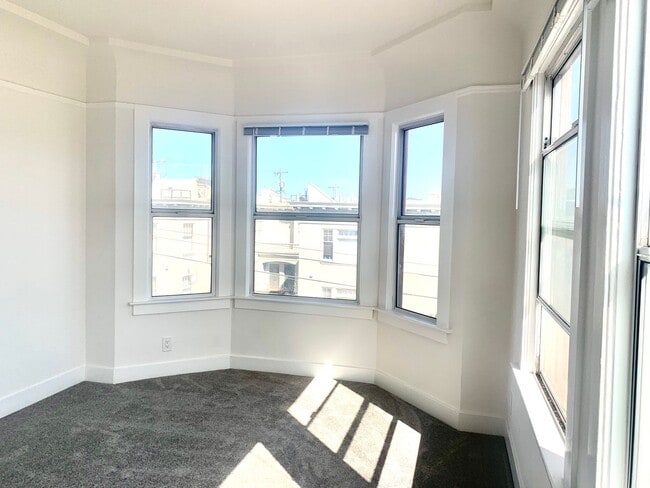 Building Photo - Exceptional Location! Sun Filled Top Floor...