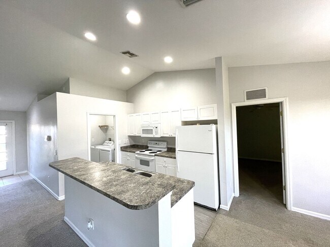Building Photo - 3 Bedroom with Den 2 Bathroom 2 Car Garage...