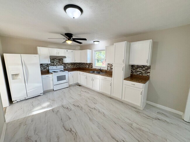 Foto del edificio - 3 bed with carport and garage