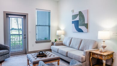 The Manchac: 1BR, 1BA- Living Room - The Oaks at Riverbend