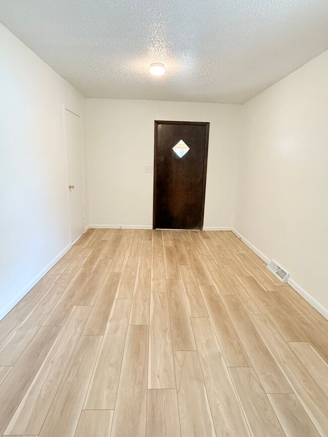 Building Photo - Spacious Home with Hardwood Floors