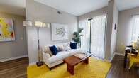 Located at 399 Main Ave in Norwalk, Connecticut, this single-floor residence offers a thoughtfully designed layout with a cohesive, contemporary aesthetic throughout. The living room serves as a welcoming centerpiece, featuring neutral gray walls, wood-style flooring, and a sliding glass door that opens to a private balcony, flooding the space with natural light and providing pleasant outdoor views. The kitchen is outfitted with stainless steel appliances, including a gas range and full-size refrigerator, complemented by crisp white cabinetry and light wood-tone flooring for a clean, modern feel. The residence includes multiple bedrooms, each finished with plush carpeting and ample natural light from large windows with blinds. One bedroom features a bold blue accent wall with greenery views, while another offers a walk-in closet and soft neutral tones. Both bathrooms are finished with white cabinetry, large vanity mirrors, and tiled tub-shower combinations, offering a clean and functional design. Throughout the residence, consistent neutral tones, updated fixtures, and thoughtful details create a comfortable and inviting atmosphere well suited for everyday living.