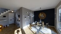This two-floor space showcases a thoughtfully designed interior that blends contemporary style with warm, inviting elements. The main living area is anchored by rich hardwood flooring that flows throughout, complementing a neutral grey color palette accented by a striking deep navy feature wall. The dining area is a standout, centered around a sleek glass-top table paired with modern metallic chairs, all illuminated by a pendant light with a gold finish. A decorative sunburst mirror mounted on the navy wall adds a bold focal point, enhancing the room's sophisticated character.

Natural light streams in generously, casting warm tones across the floors and highlighting the open layout. A partial wall divides the space, creating a natural transition between zones while maintaining an airy, connected feel. Small decorative touches—including wall-mounted planters, framed artwork, and a compact console table with a lamp—add personality and warmth throughout. The entryway is clean and functional, with a white door framed by light trim. Spanning two floors, the space offers ample room for both living and entertaining in a cohesive, modern setting.