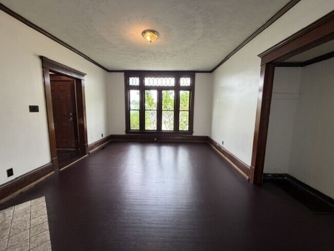 Building Photo - Spacious 4-Bedroom Home with 2 Full Baths, Central A/C & Fenced Yard!