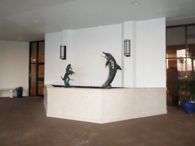 Spitting dolphin fountain to greet you! - 9650 S Ocean Dr