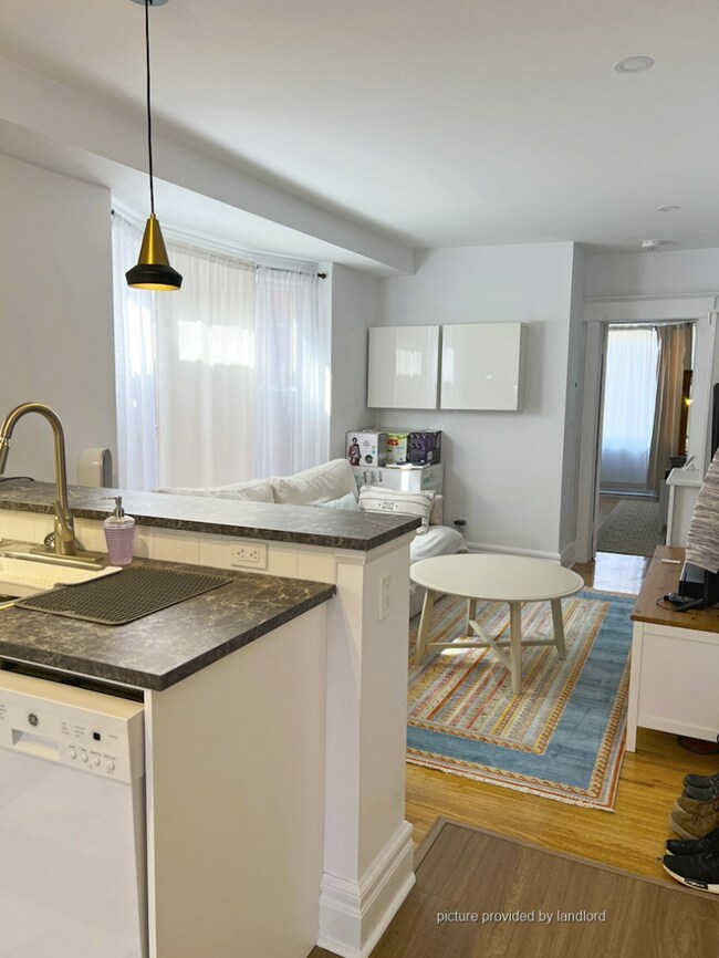 Building Photo - Warm, & bright 2nd floor suite in the famous Greek Town
