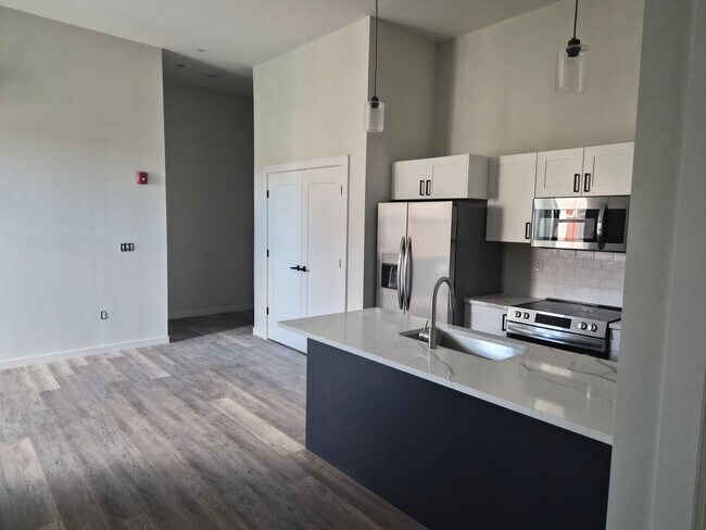 Building Photo - Downtown Claremont newly re-developed brick building with 2 Bed Luxury units, pet friendly!