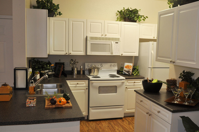 Full Kitchen with Microwave and Dishwasher - Lambertson Farms Apartment Homes