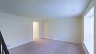 Located at 801 W Park Avenue in Lindenwold, NJ, this two-story property offers a straightforward and functional layout designed to maximize usable living space across both levels. The interiors are finished with a clean, neutral color palette — crisp white walls and light-toned trim work that creates a bright and airy atmosphere throughout. Soft, plush wall-to-wall carpeting is featured in the living areas, adding warmth and comfort underfoot. The rooms are generously proportioned, offering a comfortable sense of openness with smooth ceilings and ample overhead ventilation provided by centrally placed ceiling vents. Doorways are fitted with classic paneled doors, contributing to a timeless and consistent aesthetic. Natural and artificial lighting work together to keep the interior feeling welcoming and well-illuminated. The overall ambiance is clean, move-in ready, and versatile, lending itself well to a variety of furnishing styles and personal touches. With its two-floor configuration, the property provides a practical separation of living and private spaces, making it a well-organized and livable home in a convenient Lindenwold location.
