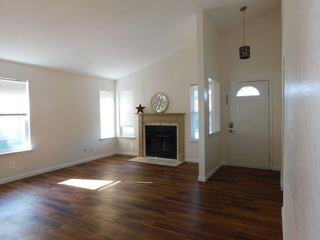 Enjoy the warmth of a fire in this wood-burning fireplace! - 2216 Cimmaron Dr