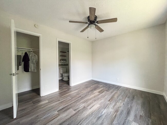 master bedroom w/ closet and bathroom inside master - 5405 Spring Meadow Rd