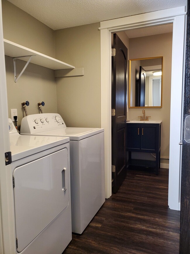 Walk through laundry room to lower level bathroom. - 2525 Cedar Hills Drive