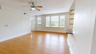 Located at 1300 Cherry St in Vicksburg, Mississippi, this single-floor residence offers a thoughtfully designed layout that maximizes comfort and functionality. The open-concept living room is a standout feature, showcasing warm hardwood flooring, a ceiling fan, and a striking bank of large windows dressed with white plantation shutters that flood the space with natural light and offer pleasant outdoor views of the surrounding greenery.

The kitchen is efficiently designed with warm wood cabinetry, granite-style countertops, stainless steel appliances including a gas range, microwave, and refrigerator, and a convenient pass-through breakfast bar that connects seamlessly to the living area. Wall-mounted open shelving adds a functional, decorative touch to the transition between spaces.

The bedroom is a comfortable retreat featuring plush carpeting, a ceiling fan, and dual windows with plantation shutters that bring in ample natural light. The full bathroom is well-appointed with warm wood vanity cabinetry, granite-style countertops, a large mirror, and tile flooring, offering a clean and practical design.

Throughout the residence, neutral tones and consistent finishes create a cohesive and inviting ambiance, making this Vicksburg home a comfortable and functional living space.