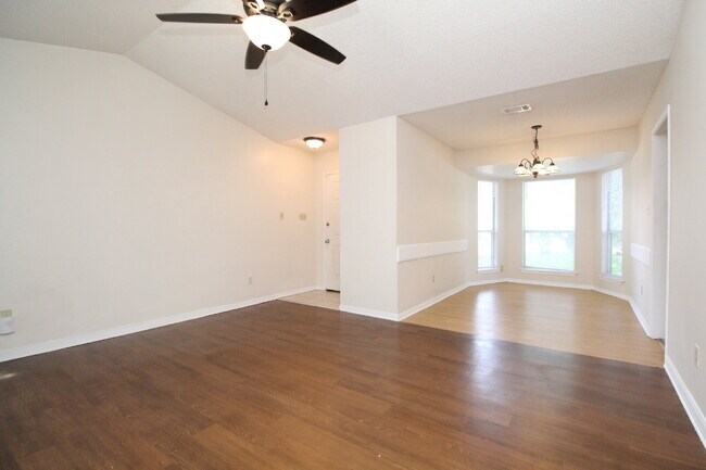 Foto del edificio - 2BR Home with Wood-Look Flooring, Fenced Backyard & Private Patio