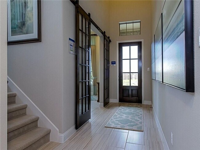 Building Photo - A large island in the gourmet kitchen anch...