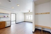 Located at 50 Drift Rd in Breckenridge, Colorado, this five-bedroom, two-bathroom residence offers a thoughtfully designed single-floor layout that maximizes every square foot. The open living area features light wood-style flooring, crisp white walls, a ceiling fan, and a built-in entryway bench with coat hooks — a practical touch well-suited to mountain living. Natural light flows through large windows that frame breathtaking snow-capped mountain views, bringing the scenic Colorado landscape indoors.

The kitchen is well-appointed with warm wood cabinetry, stainless steel appliances including a refrigerator, range, microwave, and dishwasher, complemented by a white subway tile backsplash and recessed lighting. Both bathrooms are clean and functional, each featuring a tub/shower combination with a curved curtain rod and wood-style flooring.

The bedrooms vary in finish, with some showcasing hardwood-style flooring and others featuring plush carpet, each equipped with ceiling fans. Several bedrooms include direct views of the surrounding mountains and snowy terrain, while the primary bedroom benefits from a private closet. A dedicated hallway connects the spaces efficiently, completing this well-organized mountain residence ideal for group or workforce housing in the heart of Breckenridge.