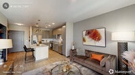 Located at 905 W Main St in the heart of Durham, NC, this one-bedroom, one-bathroom residence offers a thoughtfully designed open-concept layout finished with light wood-style flooring throughout. The kitchen serves as a central hub, showcasing sleek gray flat-front cabinetry, a classic white subway tile backsplash, stainless steel appliances, and a spacious white quartz island with seating for two — illuminated by industrial-style pendant lights. The kitchen flows seamlessly into the living room, where large windows with plantation shutters allow abundant natural light and provide a welcoming ambiance. The bedroom features a striking navy accent wall, ceiling fan, and generous windows that continue the theme of natural light. A dedicated closet with built-in shelving and hanging storage connects directly to the bathroom, which includes a tiled walk-in shower and wood-style flooring. Additional conveniences include a utility room and in-unit laundry. The space is efficiently organized across a single floor, making it ideal for comfortable urban living in one of Durham's most vibrant neighborhoods.