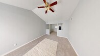 Located at 18290 Upper Bay Rd in Nassau Bay, TX, this single-story home offers four bedrooms, two bathrooms, a kitchen, hallway, entrance, and a closet within a compact yet functional floor plan. The standout architectural feature is the vaulted ceiling in the primary bedroom, which creates a dramatic sense of vertical space and openness. Soft neutral-toned carpet flows throughout the bedrooms, complemented by light gray walls and white trim that give the interior a clean, cohesive look. Each bedroom is equipped with a ceiling fan with integrated lighting, and several rooms feature windows that allow natural light and views of surrounding greenery. The spacious primary bedroom offers ample room and benefits from the soaring vaulted ceiling. The galley-style kitchen is well-appointed with white cabinetry, white countertops, a gas range, a dishwasher, a double-basin sink, and wood-look flooring, offering an efficient and bright cooking space. The two bathrooms include one with a tub-shower combination and a well-lit vanity with a large mirror, and another with a glass-door shower enclosure. The entrance features wood-look flooring, transitioning seamlessly into the rest of the home.