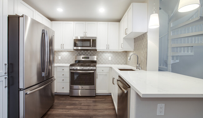 Premier kitchen with a breakfast bar and lots of cabinet and counter space - Villas at Park La Brea