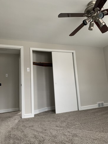 Main bedroom. Sliding closet doors. - 1310 W Kings Hwy