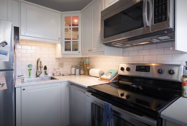 Kitchen w/new appliances, tiling, and quartz counters - 1115 12th St NW
