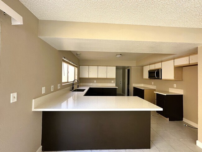 Building Photo - Newly renovated home with brand new kitchen and flooring downstairs! Home features a large living...