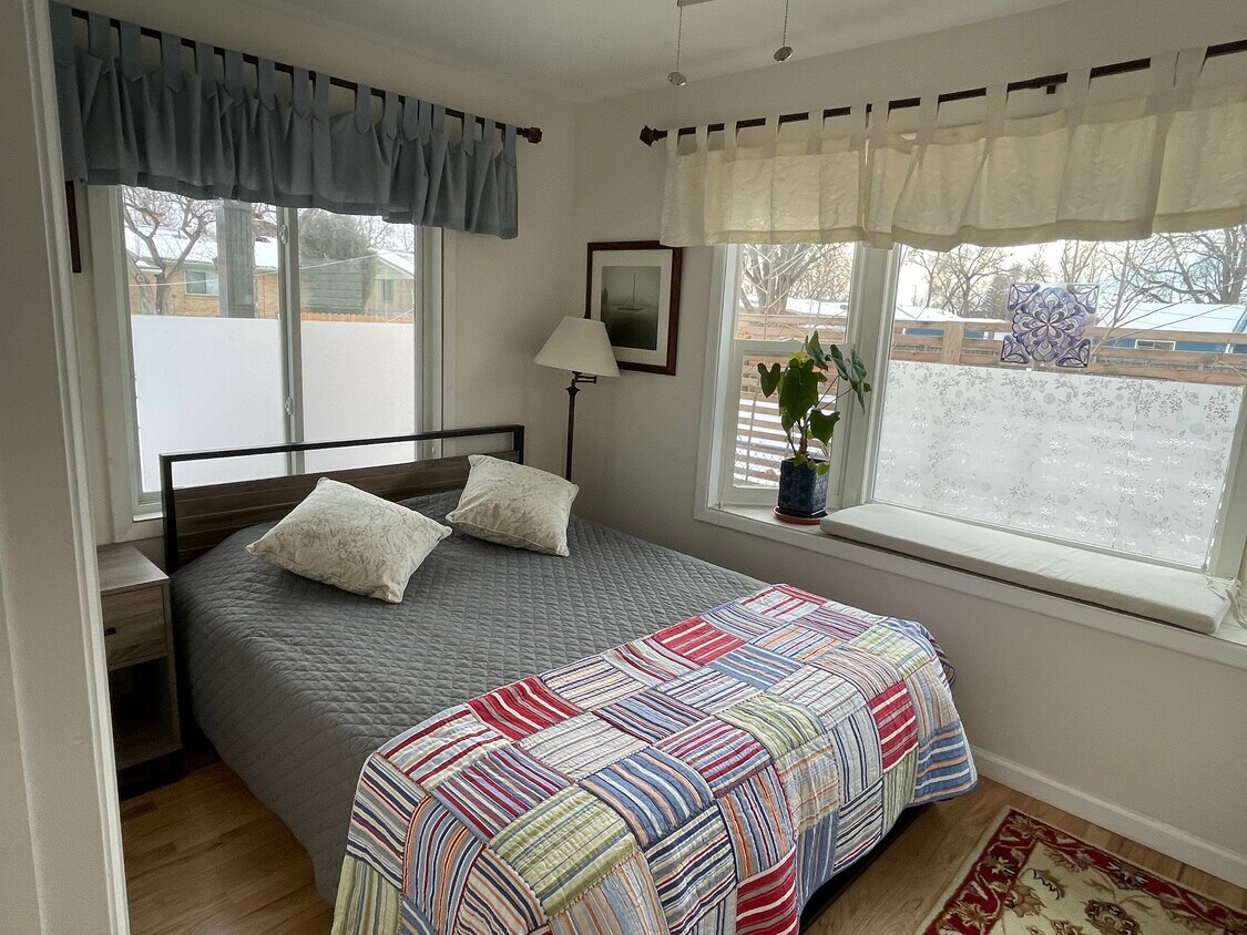 south-west facing bedroom (new Queen bed) - 1720 Corey St