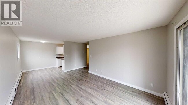 Building Photo - 10028-10105 105 Ave