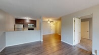 Located at 360 Lexington Pkwy S in Saint Paul, MN, this two-bedroom, two-bathroom residence offers a well-designed single-floor layout. The open living and dining area is highlighted by hardwood-style flooring, a ceiling fan with light fixture, and large windows with vertical blinds that bring in generous natural light and outdoor views. Baseboard heating runs throughout, ensuring comfort year-round.

The kitchen features dark cabinetry, stainless steel appliances including a refrigerator, range, microwave, and dishwasher, along with light countertops and a double sink. It opens conveniently to the main living area via a pass-through counter.

Both bedrooms are carpeted and comfortably sized, each offering windows with natural light and baseboard heating. The primary bedroom is a well-proportioned retreat with ample closet access. Five closets throughout the unit provide exceptional storage capacity.

The two bathrooms are finished with tile flooring and warm wood-toned vanities. One bathroom features a tub/shower combination, while the other offers a glass-enclosed stand-up shower, both equipped with brushed nickel fixtures and mirrors. Hallways connect the spaces efficiently, completing a functional and cohesive floor plan.