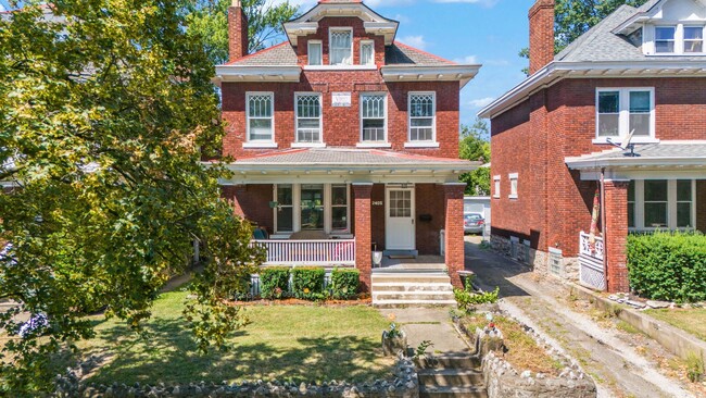 Building Photo - Charming 5-Bedroom Home with Exposed Brick...