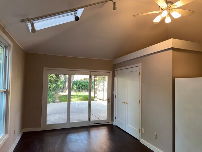 Interior with vaulted ceiling, fan and skylight. Roller shades for windows to be installed soon. - 3925 Gaspar Dr