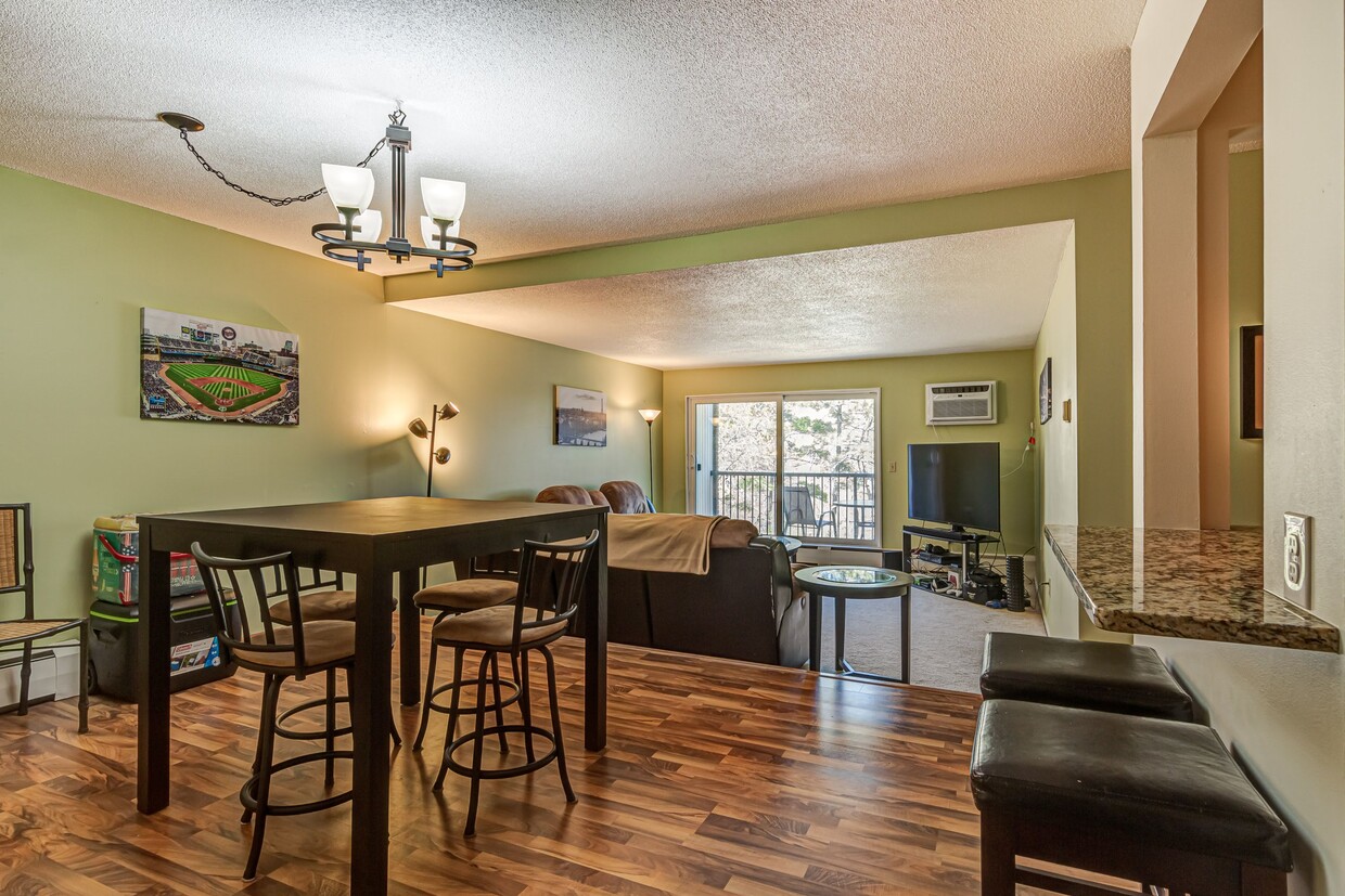 Dining Room into Living Room and Deck overlooking lake - 4860 Park Commons Dr