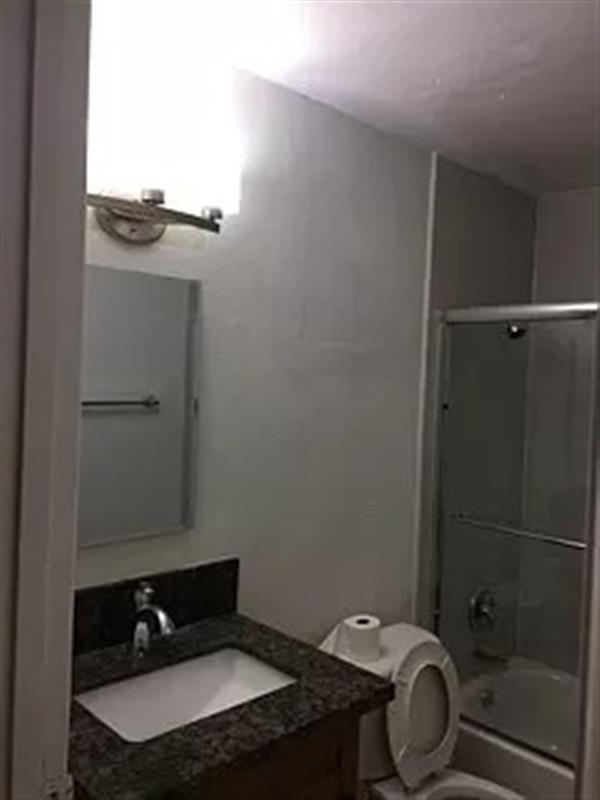Building Photo - This renovated two-bedroom
