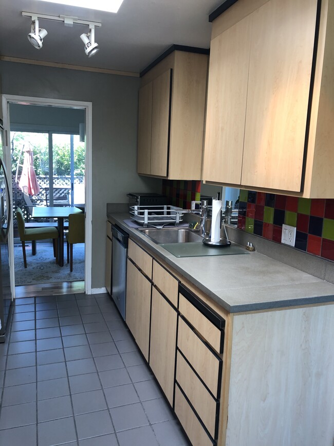 Galley kitchen looking to dining room and back patio - 96 Biscayne Dr