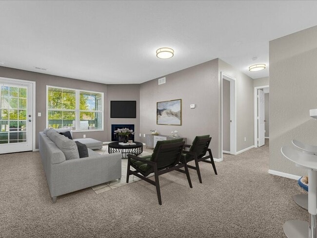 Bright and open living spaces create an inviting and airy atmosphere that feels both comfortable and spacious. - Wyndham Hill