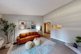 Located at 2648 First St in Napa, CA, this one-bedroom, one-bathroom residence offers a well-designed single-floor layout that maximizes every square foot. The living room is a standout feature, boasting soaring vaulted ceilings that lend an open, airy feel. Large sliding glass doors flood the space with natural light and provide direct access to a private balcony. Wood-style flooring runs throughout the main living areas, complementing the neutral gray walls.

The combined dining and kitchen area is efficiently designed, featuring white cabinetry with ample storage, light quartz-style countertops, a stainless steel dishwasher, and a pass-through window that connects to the dining space. A ceiling fan in the dining area adds comfort and functionality.

The bedroom is a comfortable retreat with plush carpeting, a window with outdoor greenery views, and a sliding-door closet. Additional storage is provided by multiple closets throughout the unit, along with a dedicated utility room.

The bathroom includes a full soaking tub and shower combination with clean, bright finishes. Three closets throughout the unit offer generous storage. This residence combines practical layout with modern touches in the heart of California's renowned Napa Valley.
