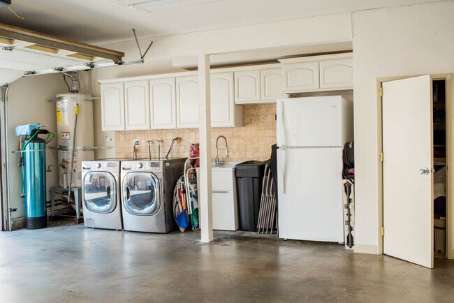 washer/dryer and water softener in garage - 7761 Via Rosa Maria