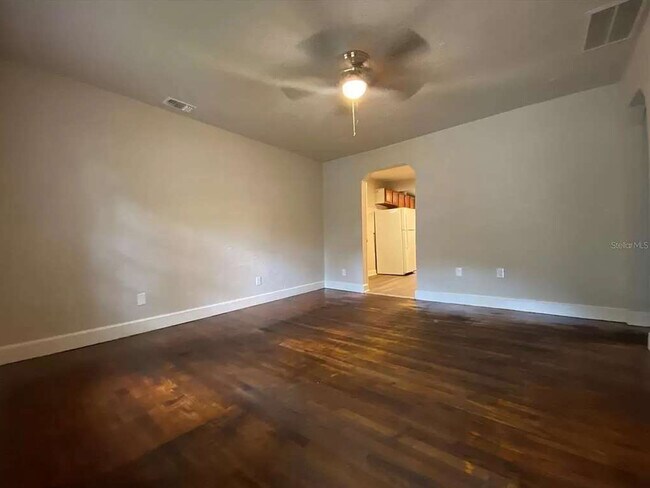 Spacious living room with original hardwood floors - 112 NE 20th St