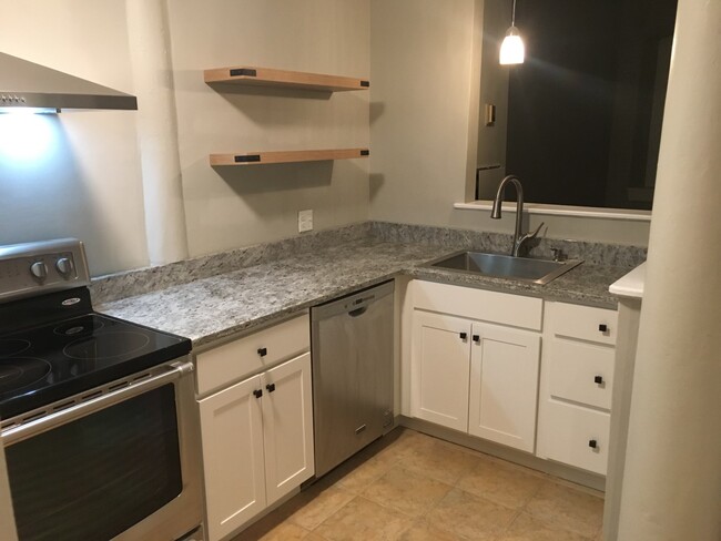 Kitchen has granite countertops - 110 Main St