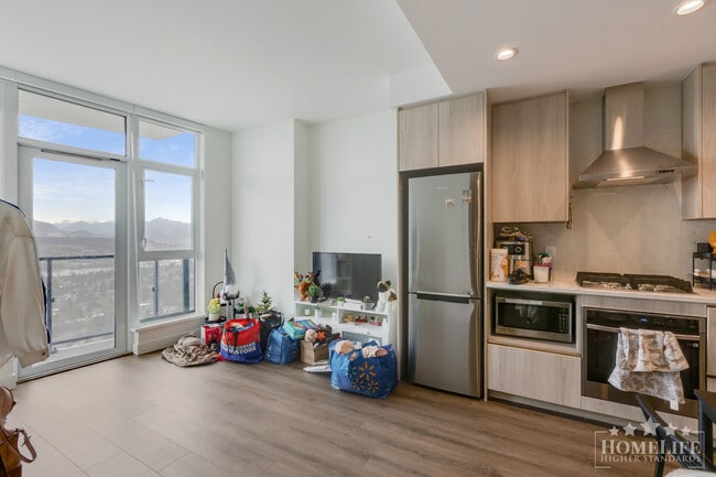 Building Photo - Modern 1 Bed + Den Condo in Surrey City Centre with Premium Amenities