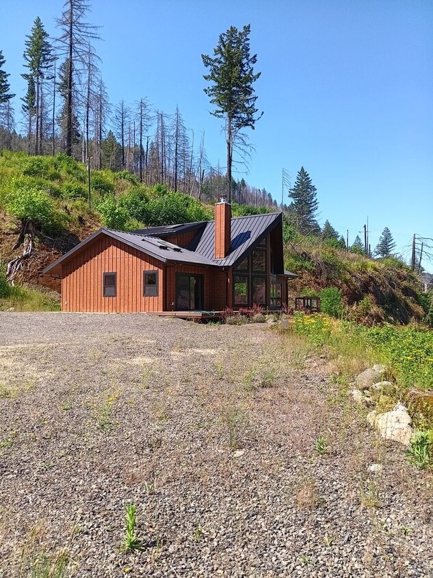 Primary Photo - Beautiful Chalet Style Riverfront Property...