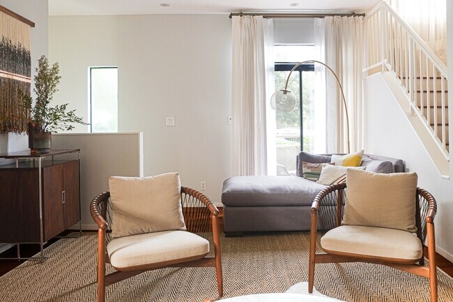 Living room with huge recessed projector screen and balcony - 2201 7th St