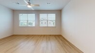 Located at 11305 Grant Rd in Houston, TX, this single-story residence offers a thoughtfully designed layout with 1 bedroom and 2 full bathrooms. Light-toned luxury vinyl plank flooring runs consistently throughout the home, creating a clean, cohesive aesthetic. The open-concept kitchen is a standout feature, equipped with stainless steel appliances including a French door refrigerator, electric range, and over-the-range microwave. Crisp white shaker cabinetry, a subway tile backsplash, and granite countertops with an undermount sink at the island complete the modern look. The living area benefits from multiple windows fitted with blinds, allowing ample natural light and neighborhood views, complemented by a ceiling fan overhead. The bedroom is a comfortable, well-proportioned space with a ceiling fan, natural light from a window, and easy access to the adjoining rooms. Both bathrooms are finished with granite-topped white vanities and tub/shower combinations elegantly surrounded by large-format marble-look tile. Neutral wall tones and recessed lighting throughout the space contribute to a bright, contemporary ambiance suited for everyday living.