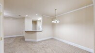 Located at 121 Margie Dr in Warner Robins, Georgia, this single-story, 3-bedroom, 1-bathroom home offers a comfortable and functional layout. The open-concept living area flows seamlessly into the kitchen, which features white cabinetry, a peninsula countertop, and recessed lighting — creating an inviting hub for daily living. Ceiling fans are present throughout the home, ensuring year-round comfort in every room.

The generously sized primary bedroom provides an expansive retreat, with plush carpeting, a ceiling fan, and direct access to a well-organized walk-in closet outfitted with multi-level wire shelving for ample storage. The two additional bedrooms are carpeted and bright, each featuring ceiling fans and windows with blinds that allow natural light while maintaining privacy. Each bedroom also benefits from dedicated closet space.

The bathroom is thoughtfully designed, featuring both a soaking tub and a separate glass-enclosed shower, with a glass block window that diffuses natural light while preserving privacy. Throughout the home, neutral warm-toned walls and clean white baseboards contribute to a cohesive, move-in-ready aesthetic. A hallway connects the bedrooms efficiently, and the overall layout maximizes the home's well-proportioned single-floor footprint.