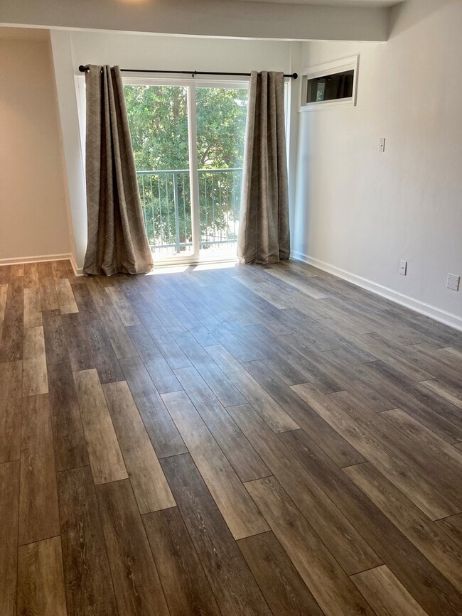 Inviting living room with desirable floors throughout the condo. - 800 Post Oak Blvd