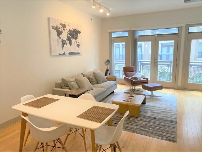 Relax in the spacious living area. - 1901 Post Oak Blvd
