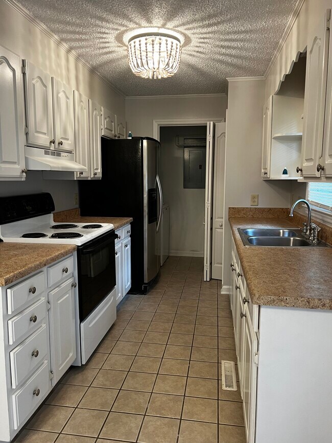 Kitchen with electric appliances and laundry - 104 Mountain Chase