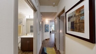 Located at 3111 S St in Sacramento's desirable Curtis Park area, this well-appointed two-bedroom, two-bathroom residence offers a thoughtfully designed single-level layout. The open-concept living area features wood-style plank flooring, neutral tones, and large windows that invite generous natural light and outdoor views. The living room provides a welcoming, spacious feel with clean lines and contemporary styling.

The kitchen is a standout, boasting rich dark-wood cabinetry, white quartz countertops, a subway tile backsplash, and a full suite of stainless steel appliances. The layout offers ample counter space and storage, making it both functional and visually striking.

The primary bedroom is a comfortable retreat with plush carpeting and direct sightlines to the kitchen and living area. The second bedroom also features carpet flooring and a versatile layout suitable for a guest room or home office.

Both bathrooms are finished with dark wood vanities, white countertops, and tub-shower combinations. Wood-look flooring carries through each bathroom, maintaining a cohesive aesthetic. Two hallways connect the rooms efficiently, each with closet access providing practical storage solutions throughout.

Overall, the residence presents a modern, cohesive design with quality finishes and a functional floor plan well-suited for comfortable urban living in Sacramento.