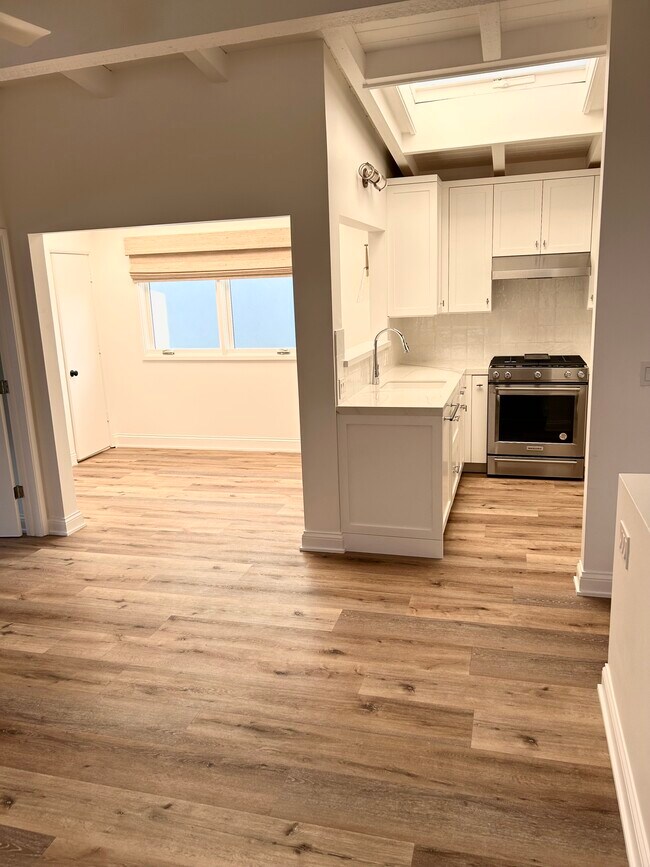 View from living room to kitchen & office/dining - 313 Sapphire Ave